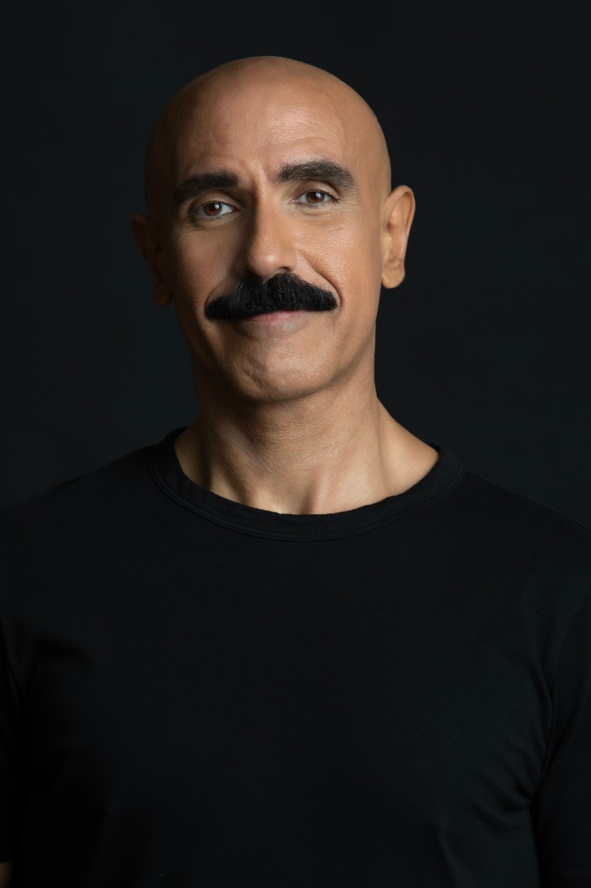 Lifestyle portrait of Gabriel Pablo Axarlian in a black T-shirt